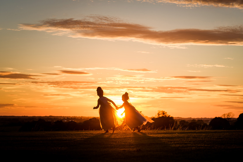 Flower Girls Running Sunset Wedding