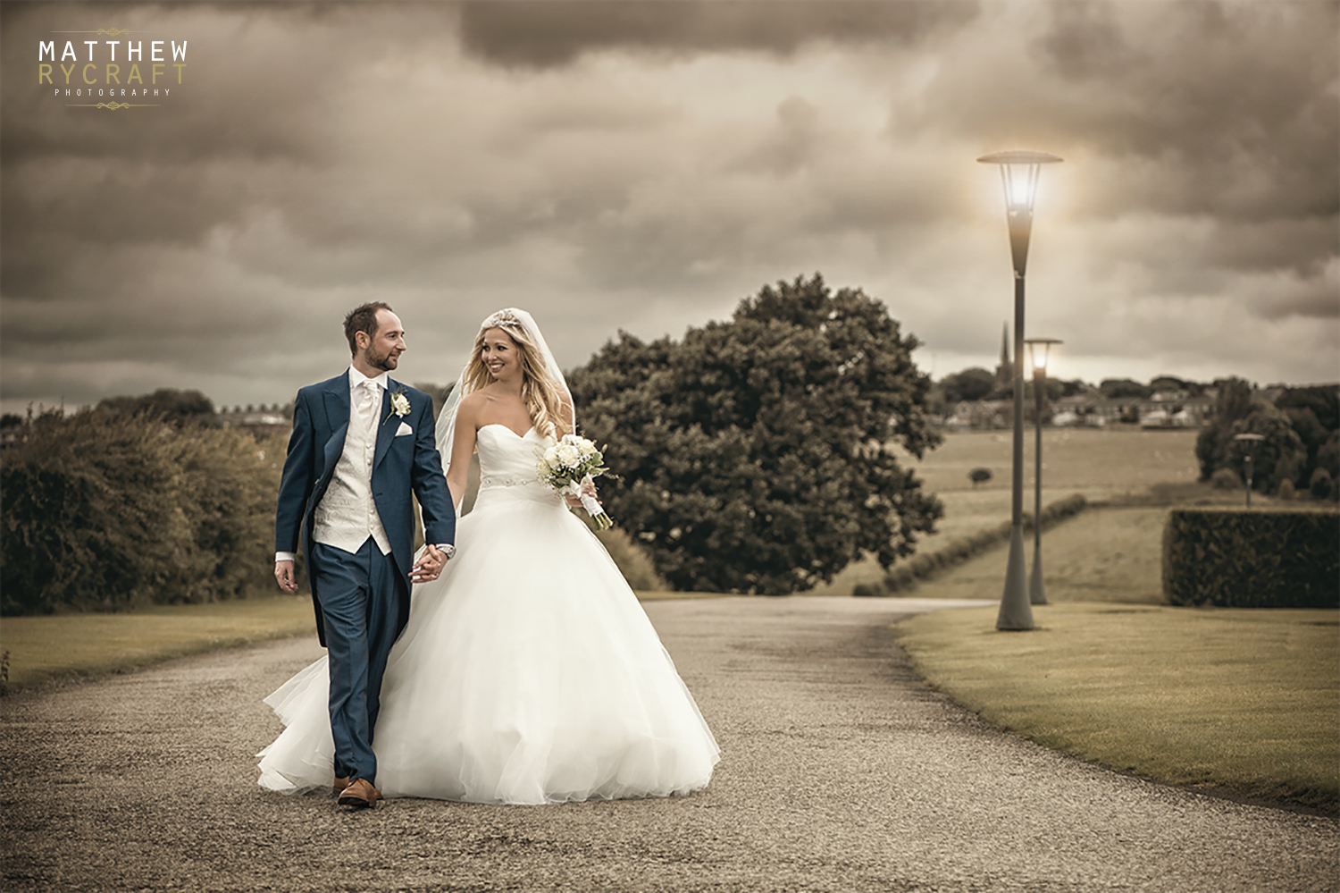 Bride and groom walking holding hands copy