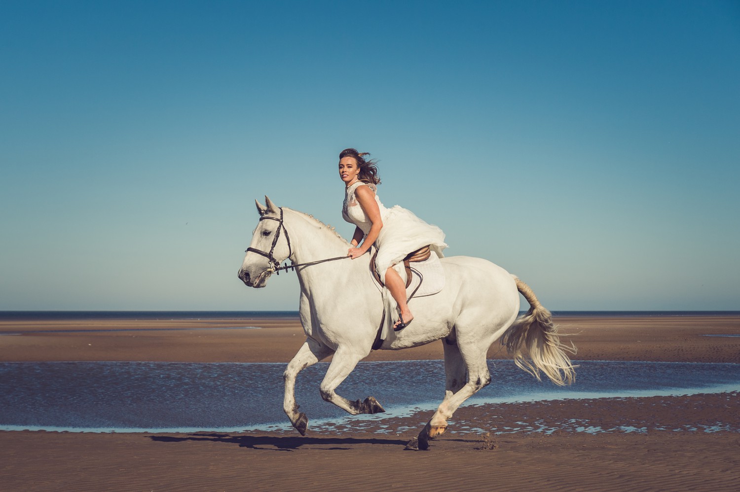 Liverpool wedding photographer Bride Riding Horse Merseyside Beach