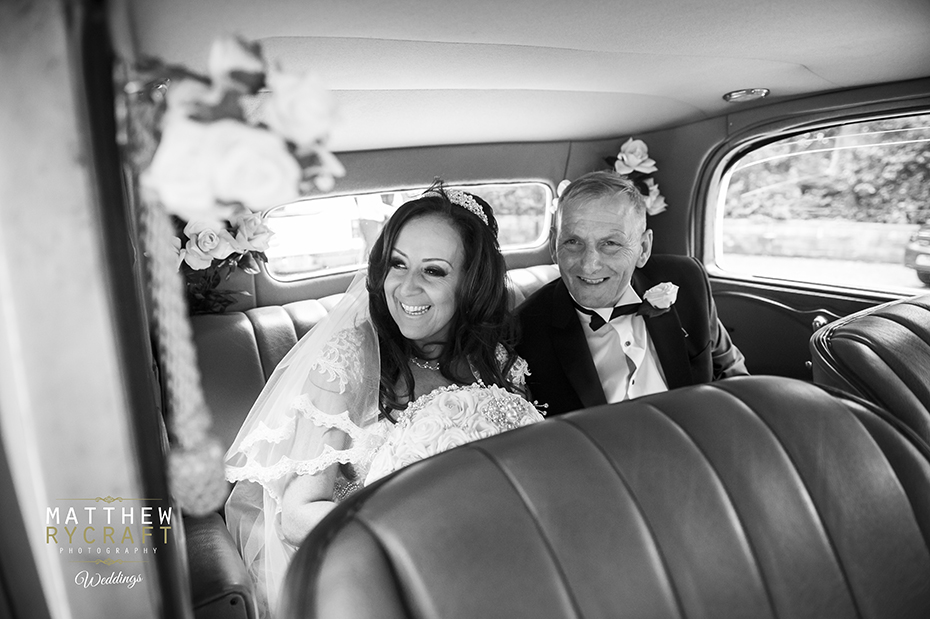 Bride with Father in Wedding Car
