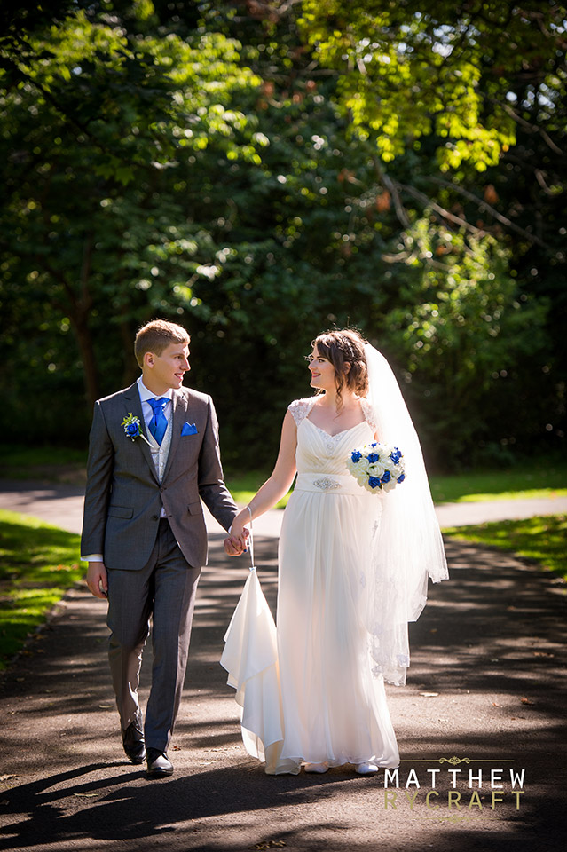 Bride and Groom Walking Holding Hands